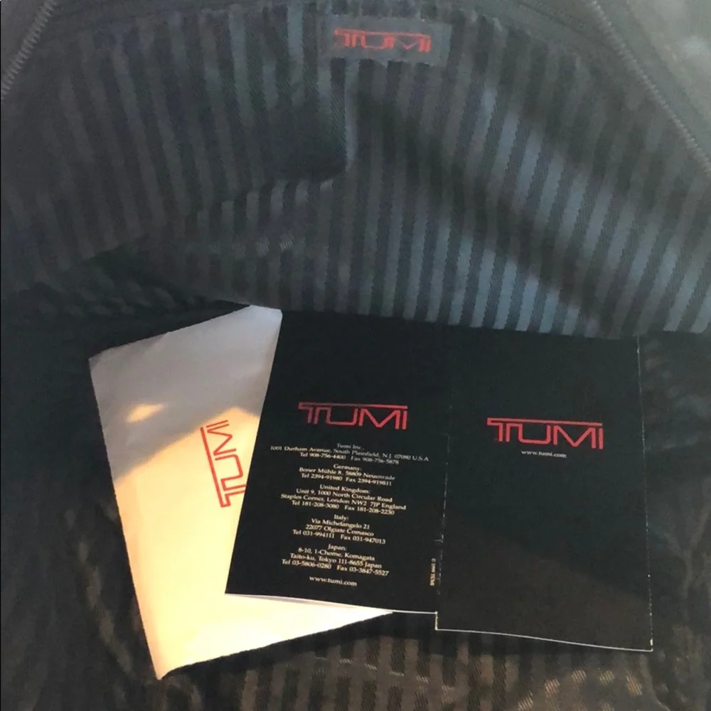 Tumi expandable crossbody suitcase/briefcase